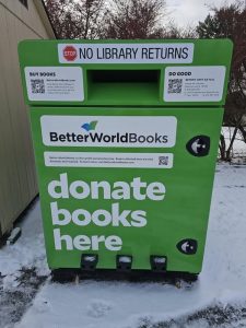 Photo of green book donation bin that reads: No Library returns. BetterWorldBooks. Donate Books Here.