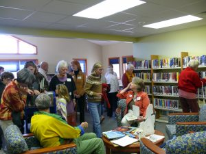 Large group of people enjoying new library building