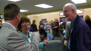 People smiling at library grand opening